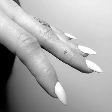 Finger crossed tattoo with a little decor. Ashlee Simpson S Tattoos Meanings Steal Her Style