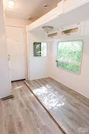 The interior of the van came standard with carpeted floors and walls, and our lack of insulation (and excess amount of windows) meant we were kind of stuck dealing with whatever temperatures mother. Installing Vinyl Plank In An Rv With A Pull Out Our Diy Camper 2 0 The Diy Mommy