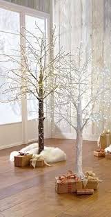 Lighted Stick Trees Are An Unconventional Stylish Option For The Holidays Forgo The Traditional Chr Twig Christmas Tree Christmas Branches Led Christmas Tree