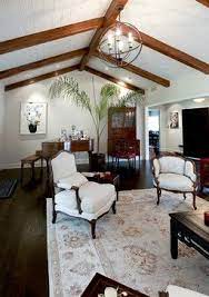 Exposed ceiling beams are an architectural feature that allows rooms to have higher ceilings or a decorative element that adds charm. High Ceilings With Beams Design Ideas Pictures Remodel And Decor Beams Living Room Traditional Living Room Beam Design