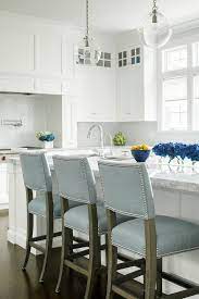 Use the same colour cabinetry for the dining portion of the kitchen island but drop the height by just enough to make it useable as a dining table. White On White Kitchen Baby Blue Pop Jem Cabinetry Stools For Kitchen Island Classy Kitchen Kitchen Stools