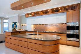 Oval kitchen island with black countertop kitchen lighting wood cabinet furniture. Oval Kitchen Island Complement The Interior With Elegant Curved Lines