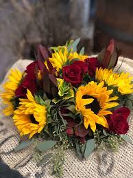 Red roses and yellow sunflowers are arranged with assorted greens & curly willow in a raffia synched gathering vase with yellow rocks. Wrap Sunflowers And Roses In Burlap In Modesto Ca Fresh Ideas Flower Co