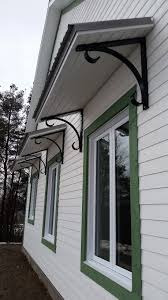 Structure Pare Soleil Concue Fabriquee Et Installee Par Mcclure Construction Pour Une Durabilite Accrue Un Cachet Incom Outdoor Decor Garage Doors Home Decor