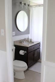 Round mirror over bathroom vanity bathroom mirrors and. Bathroom Makeover With Bold Paint Vanity Lights The Diy Playbook Round Mirror Bathroom Bathroom Mirrors Diy Bathroom Lighting Diy