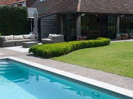 authentic clay pavers provide a seamless transition between the interior and the exterior tuin zwembad exterieur tuinhuis