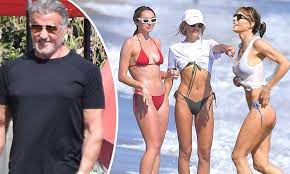 Sylvester stallone and his wife jennifer flavin have been together for 23 years, which is no small feat. Sylvester Stallone Hits The Beach With Wife Jennifer Flavin And Daughters Sophia And Scarlet Daily Mail Online