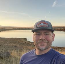 Retrofitting a hooklift dumpster with a cable hook