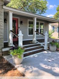 Installing a railing around your outdoor living space helps define the area and make it more attractive. My Finished Front Porch Steps And Railings Addicted 2 Decorating