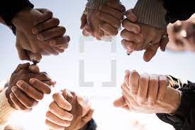 In christianity, the laying on of hands is both a symbolic and formal method of invoking the holy spirit primarily during baptisms and confirmations, healing services, blessings, and ordination of priests, ministers, elders, deacons, and other church officers. Holding Hands In Prayer Photo Lightstock