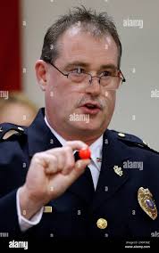 Economy police Chief Michael O'Brien shows a red rubber ball during a news  conference
