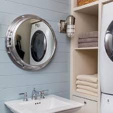 You can mount the cabinet on the wall and use it as a mirror above the bathroom sink. Nautical Porthole Medicine Cabinet Design Ideas