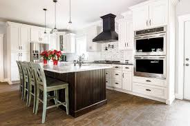 Traditional White Cabinets With Black Overhead Range Hood And Rustic Wooden Floors Wholesale Kitchen Cabinets Kitchen Cabinets Kitchen Cabinet Manufacturers