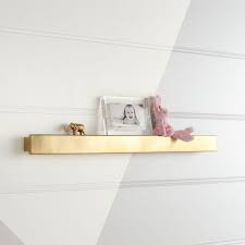 Part shelf, part picture frame, this set of three cube shelves turns anything inside of them into featured artwork. Metallic Gold Wall Shelf Reviews Crate And Barrel