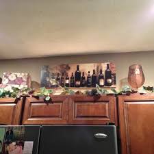 Wine Decorations For Above Kitchen Cabinets I Can Add Our Trip Pictures Wine Decor Kitchen Wine Theme Kitchen Decorating Above Kitchen Cabinets