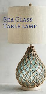 Inspired By Glass Fishing Floats Our Teardrop Sea Glass Table Lamp With Rope Netting Is Sure To Give Your Coastal Decor Beach Inspired Decor Glass Table Lamp