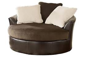 The Victory Chocolate Oversized Swivel Chair From Ashley Furniture Homestore Afhs Com The Rich Upholstery Fabrics Al Furniture Home Furniture Swivel Chair