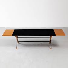 Grossman, pictured circa 1943, was the creator of, clockwise from bottom left: Coffee Table With Folding Leaves By Greta Magnusson Grossman Ct544 R Company