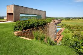 Contemporary Hillside Home In Brazil Disappears Into The Landscape