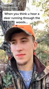 Hunter Walking Being Watched by Deer