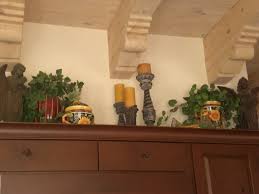 Pin By Ann Davis On Kitchen Ideas Tuscan Decorating Kitchen Decorating Above Kitchen Cabinets Tuscan Kitchen