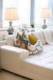 An editorial stylist invites us inside her beautiful coastal home. White Leather Tufted Couch Home Living Room White Leather Couch Home Decor
