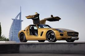 The Desert Gold Mercedes Benz Sls Amg In Front Of The Burj Al Arab Dubai Mercedes Benz Sls Amg Mercedes Benz Cars Mercedes Benz