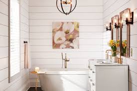 This bathroom uses farmhouse white with subway tile and wood floors, but makes it more modern with black grout, industrial/retro lighting. Modern Farmhouse Bathroom Shop By Room The Home Depot
