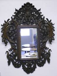 Wonderful warm patina that only comes from age and use. Black Forest Hand Carved Mirror Circa 1850 70