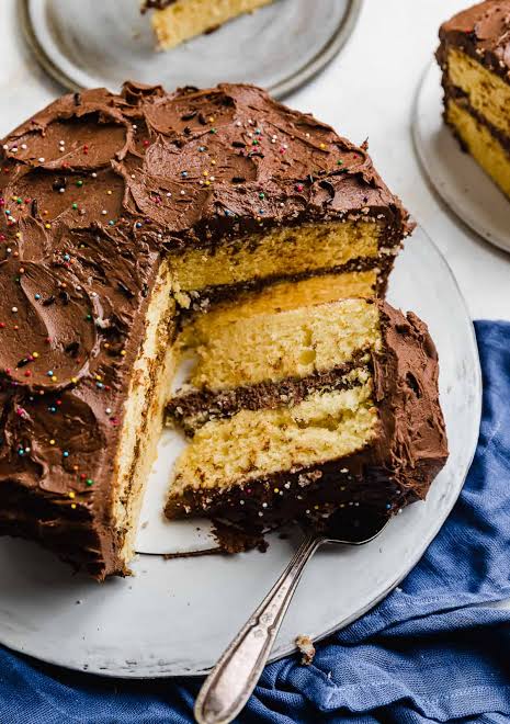 Classic Yellow Cake slice with chocolate frosting