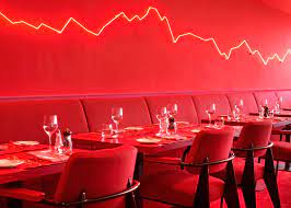 a wall of salt railway clocks and a rock hung from climbing ropes all feature in rolf sachs swiss restaurant interieurontwerp interieur ontwerpen restaurant