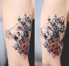 Although most flowers would make great additions to your tattoo garden, some are more popular than others. Original Combined Colored Upper Arm Tattoo Of Koala Bear With Flowers Tattooimages Biz