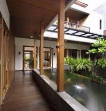 The lush tropical climate of bali resulted in a very distinctive architecture with the use of large, pitched roof overhangs, lots of wood and bamboo finishes. Pin On Balinese Style Home