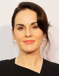 Michelle Dockery attends the "Downtown Abbey: The Grand Finale" world  premiere 🩵 The actress debuted her growing baby bump