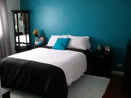 A modern boho master bedroom with dark teal, copper and white colors. Dark Teal And White Bedroom Ideas Design Corral