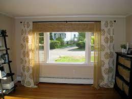 If your home has multiple large windows in a row, you can save money by installing drapes only on the outside edges, like bookends. Living Room Window Treatment For Large Window Vtwctr