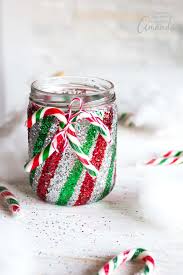 You can easily decorate mason jars for gifts by tying colorful ribbon or twine around the rim of a glass and attaching a gift tag—we'll show you how. Mason Jar Luminary Candy Cane Inspired Glittery Mason Jars