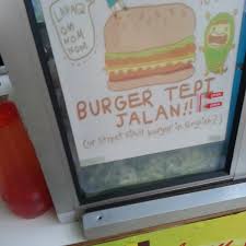 The act of consuming by fire or heat, or of subjecting to the effect of fire or heat; Burger Tepi Jalan Don Burger Joint