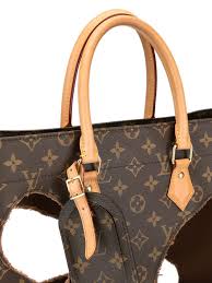 Louis vuitton has many leather good specialist workshops throughout europe along with many in the usa. Louis Vuitton Pre Owned X Comme Des Garcons Burned Holes Monogram Tote Farfetch
