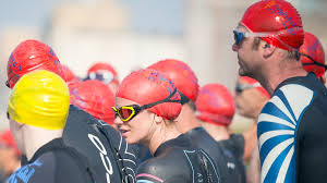 Open water dilemma – wetsuit or skins? - Swimming.org