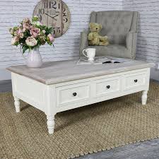Generally the rule is that your coffee table should be the same height as your couch's seat (give or take one to two inches, but not any lower). Antoinette Range Cream Coffee Table A Gorgeous Cream Coffee Table In An Elegant French Sty Distressed Coffee Table French Style Furniture French Coffee Table