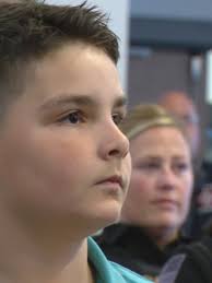 Cumberland police, fire, EMT adopt boy, 8, after battling brain tumor