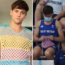 He is a father, a knitter, and a Gold medal WINNER! Can he be way more  perfect?!