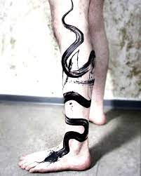 Black Paint Brush Stroke Snake Tattoo On The Leg Done By Lina Tattoo Black Snake Tattoo Snake Tattoo Designs Snake Tattoo Leg