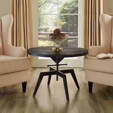 With these adjustable coffee tables you can netflix and chill in the evening, and put your feet up, while you pound on the top is made of brown solid wood; Industrial Round Coffee Table With Wooden Top And Black Iron Base Gaspar