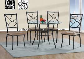 Match your unique style to your budget with a brand new black metal dining room chairs to transform the look of your room. China Unihomes Round Glass Dining Table With Black Metal Frame Metal Chairs Kitchen Table Furniture Modern Wood 4 Breakfast 5 Piece Stylish Apartment Home China Dining Table Dining Table Set