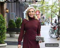 June Diane Raphael braless in a burgundy dress in Soho in New York City  (30.04.2019) - AZNude