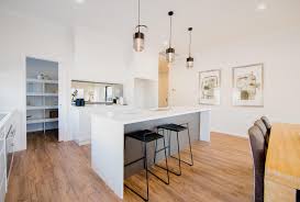 Spacious Kitchen With Polished Wood Flooring Pendant Lighting Kitchen Design Trends Home Kitchens Spacious Kitchens