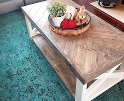 Use the plywood, 2×2, 1×8, and 1×4 wood slats to build this white farmhouse coffee table, which will be a big love of rustic decor lovers. The Look For Less Farmhouse Herringbone Coffee Table Coffee Table Farmhouse Build A Coffee Table Diy Coffee Table