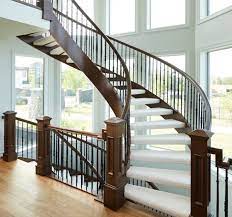 Thanks to bending rail, it's not that difficult to form curved handrail sections for a circular staircase on site. China Modern Curved Staircase With Wrought Iron Railing Oak Wood Tread China Staircase Curved Staircase